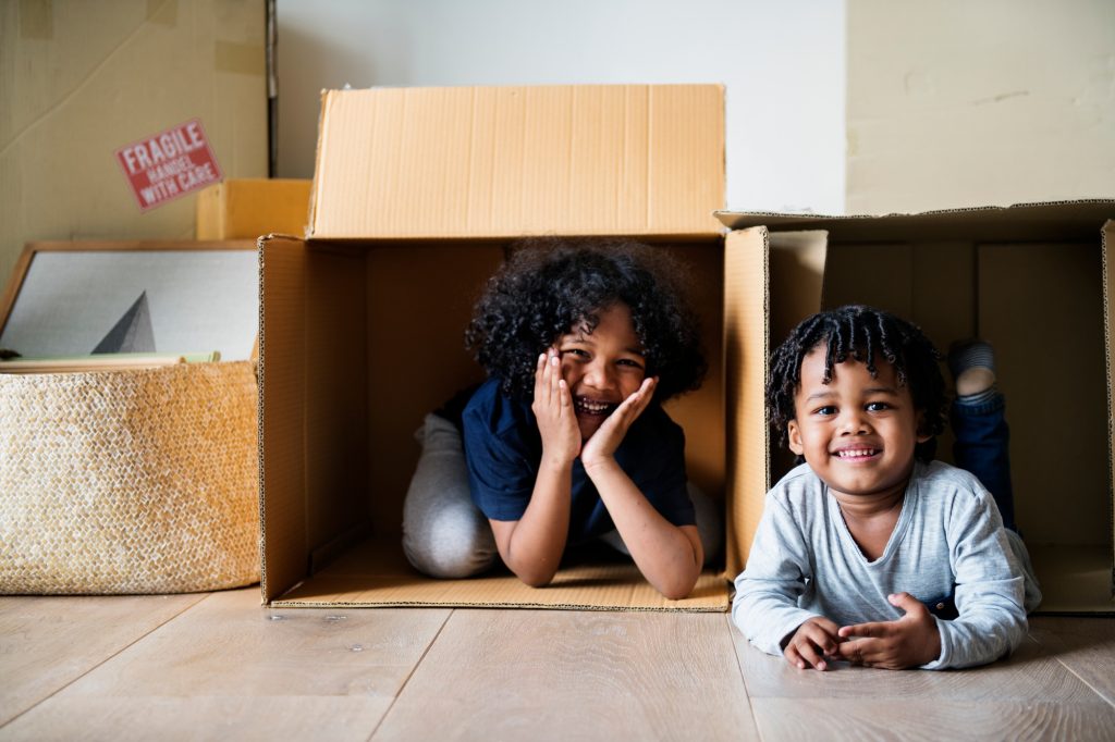 Young African kids moving to new house